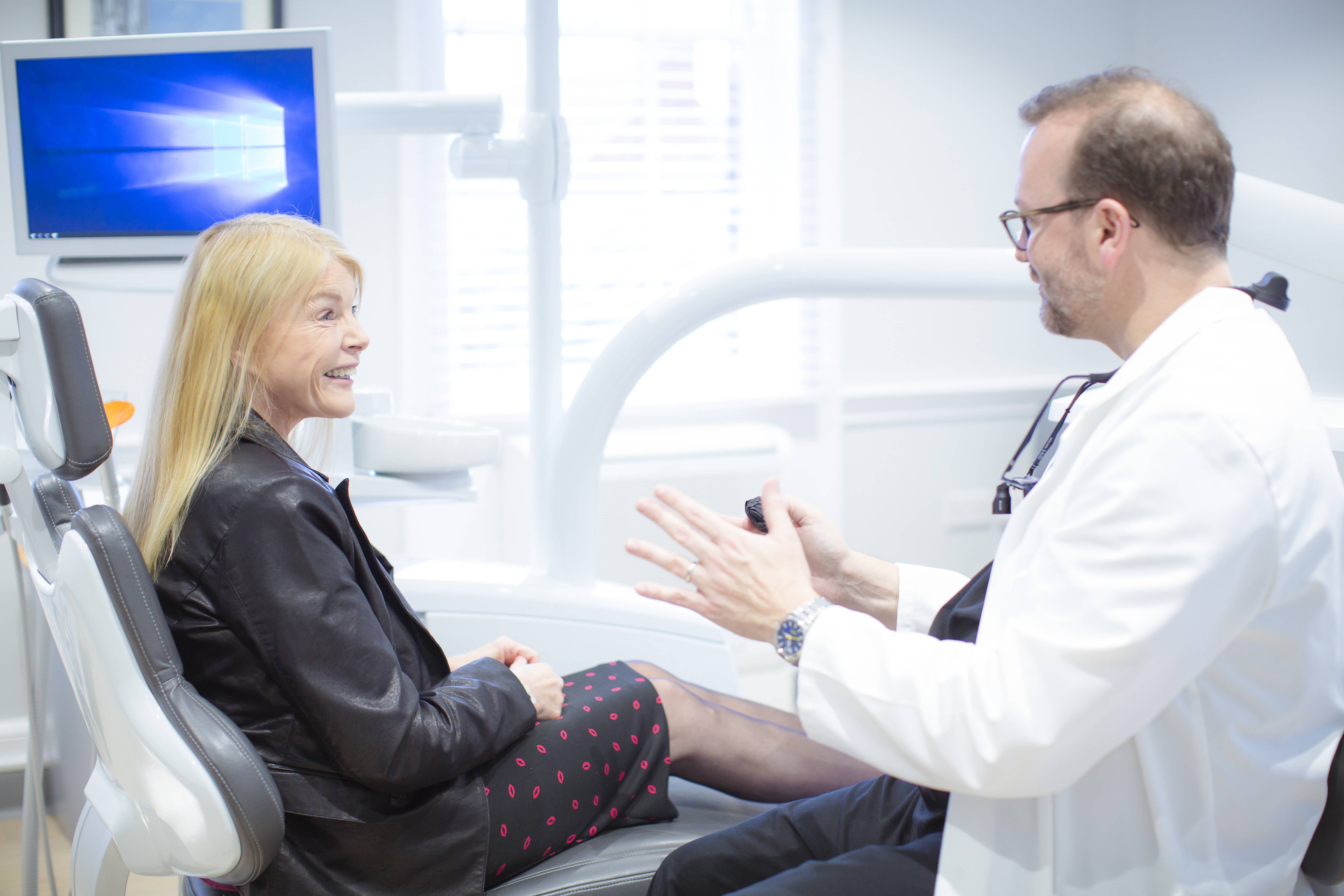 Mark Hughes talking a patient through her consultation at Canon House Clinic