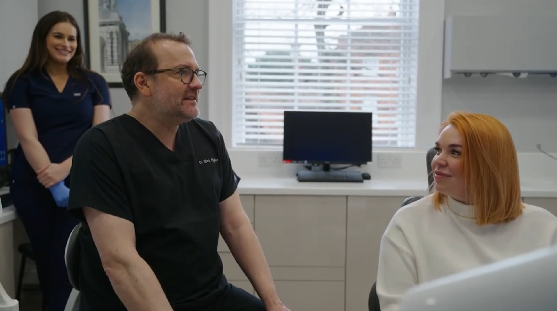 The Canon House team with a patient in the practice