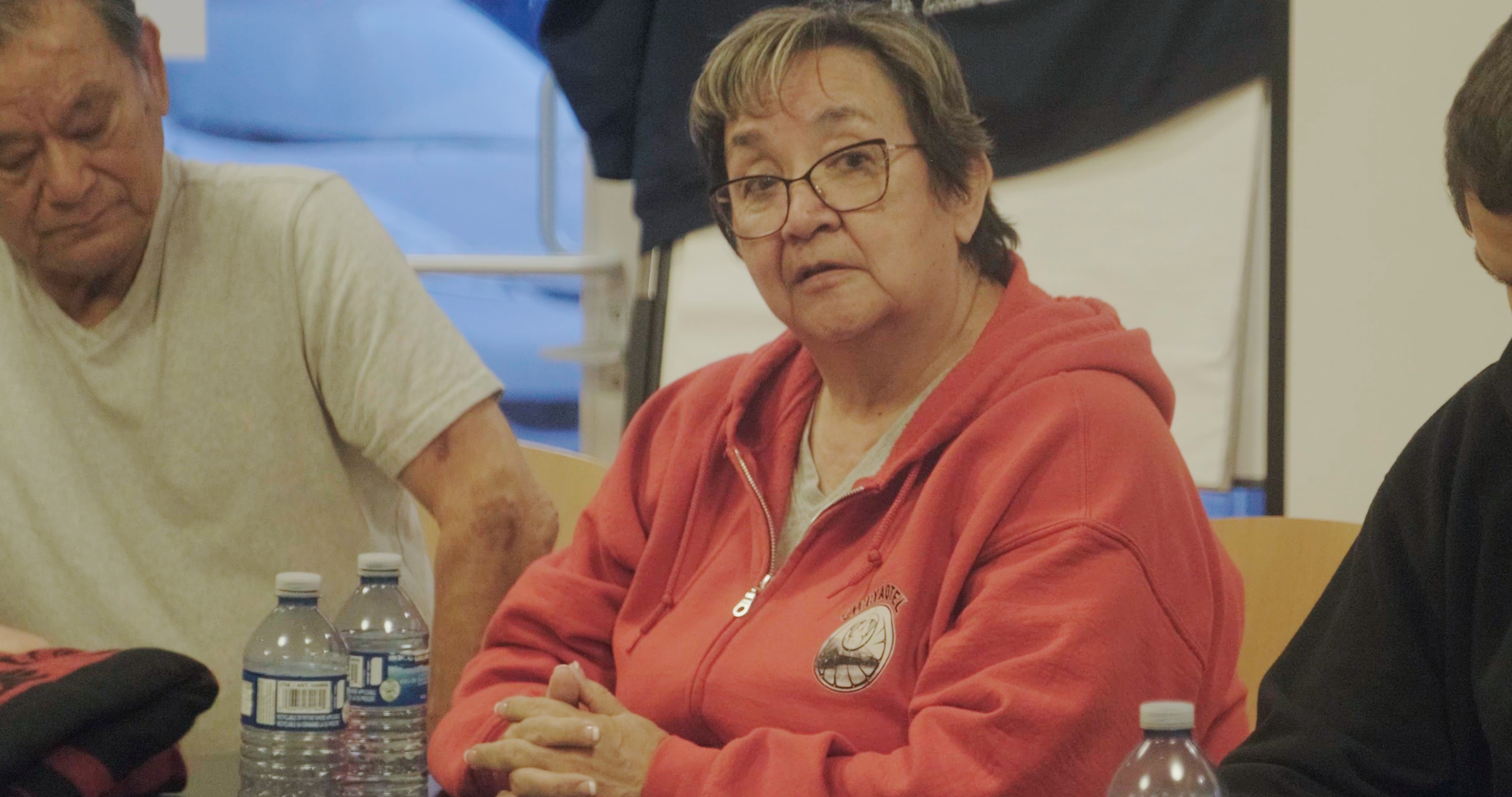 An elder listening at the table