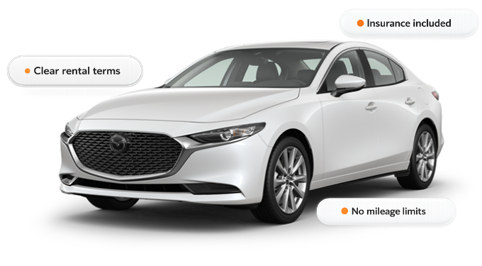 White sedan promoting dependable monthly transportation from Drive Malin