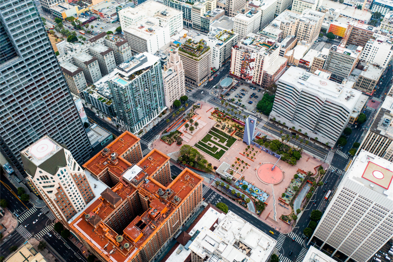 Aerial view of city properties representing real estate investment analysis and consulting services
