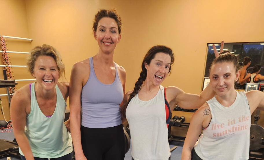 Personal trainer Allison Cole posing with her clients at 4Balance Fitness Greenville SC