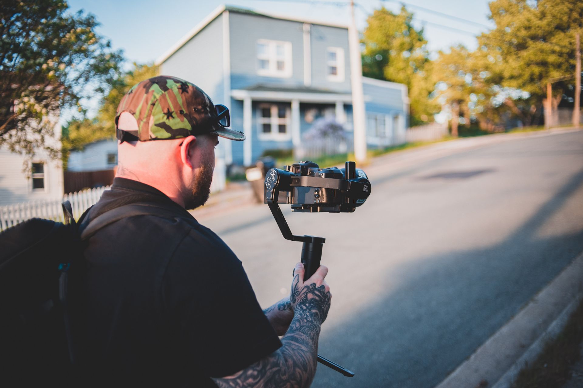 Videographer filming a neighborhood street