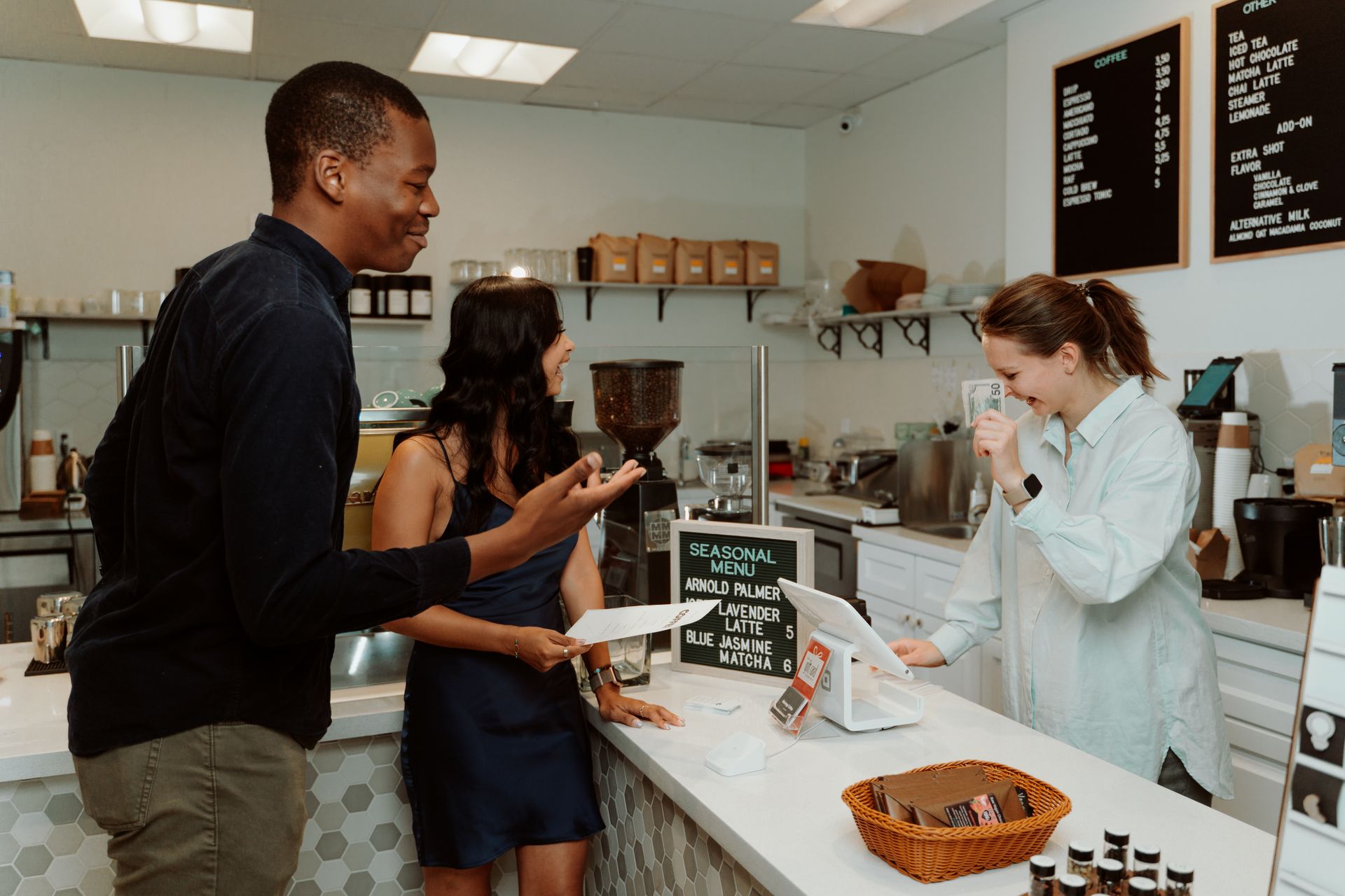 Couple ordering at a cafe counter