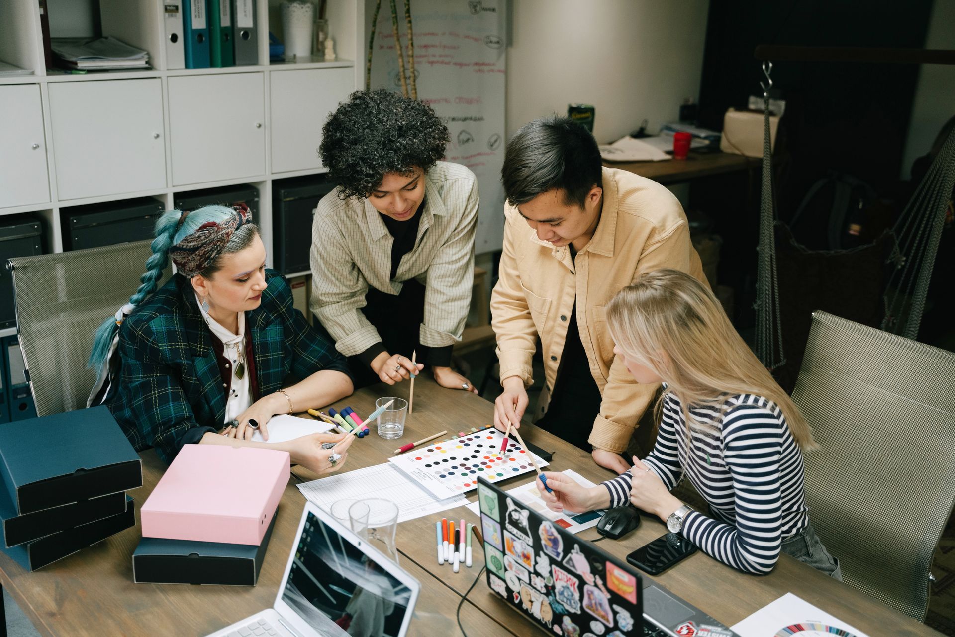 Small team planning a campaign around a table