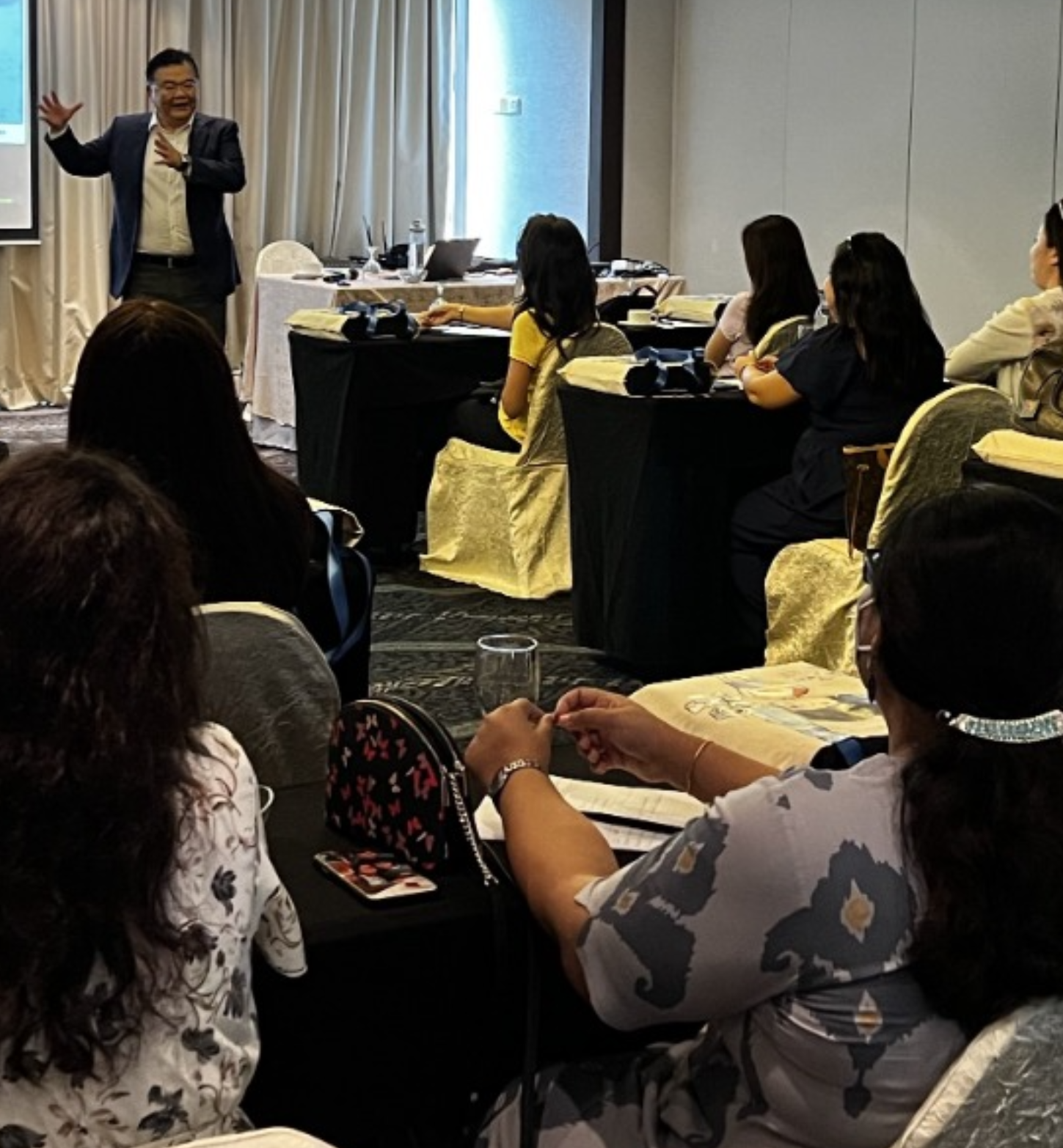 Dr Norman Tien leading a math thinking workshop with parents