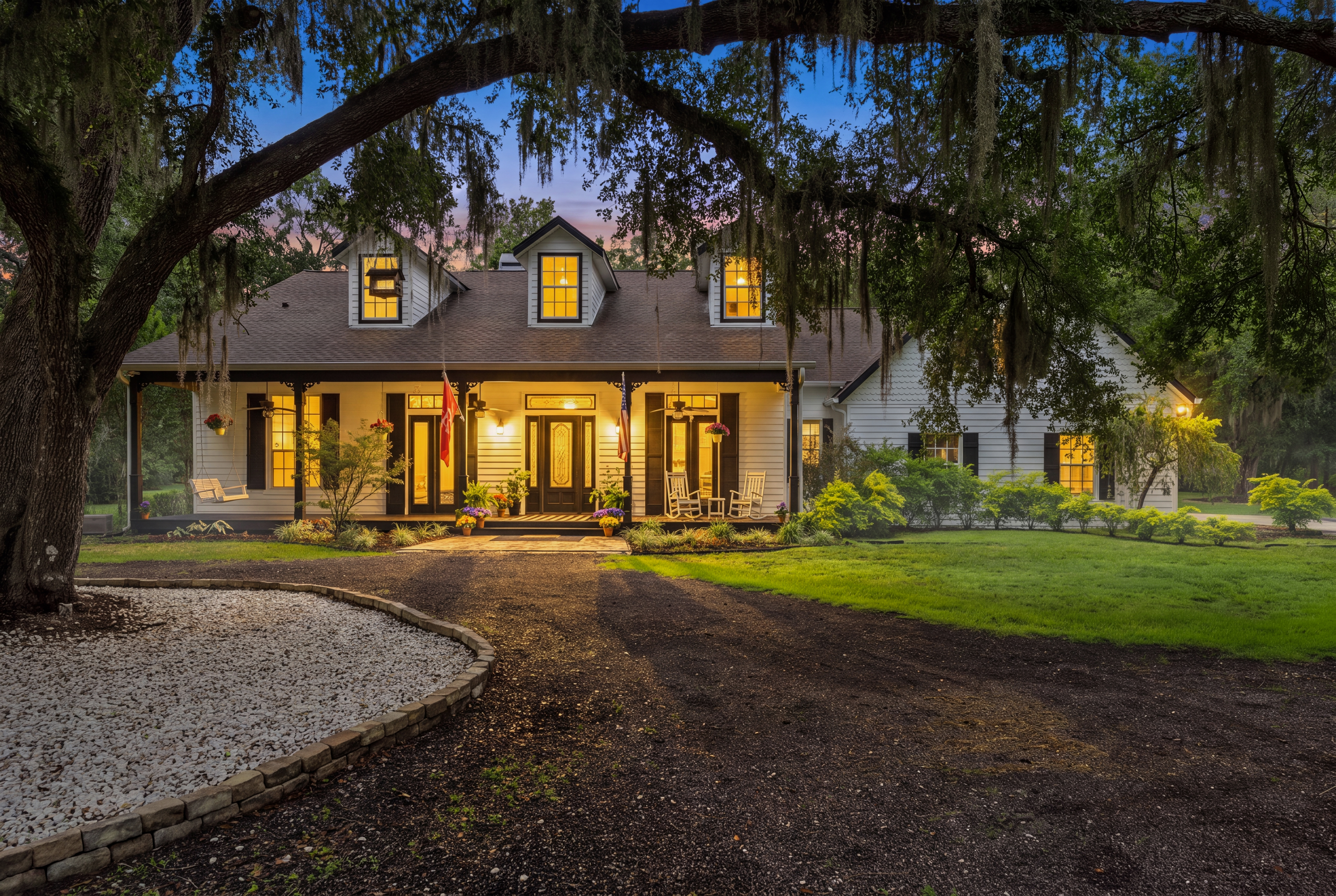 Custom modern farmhouse exterior twilight view