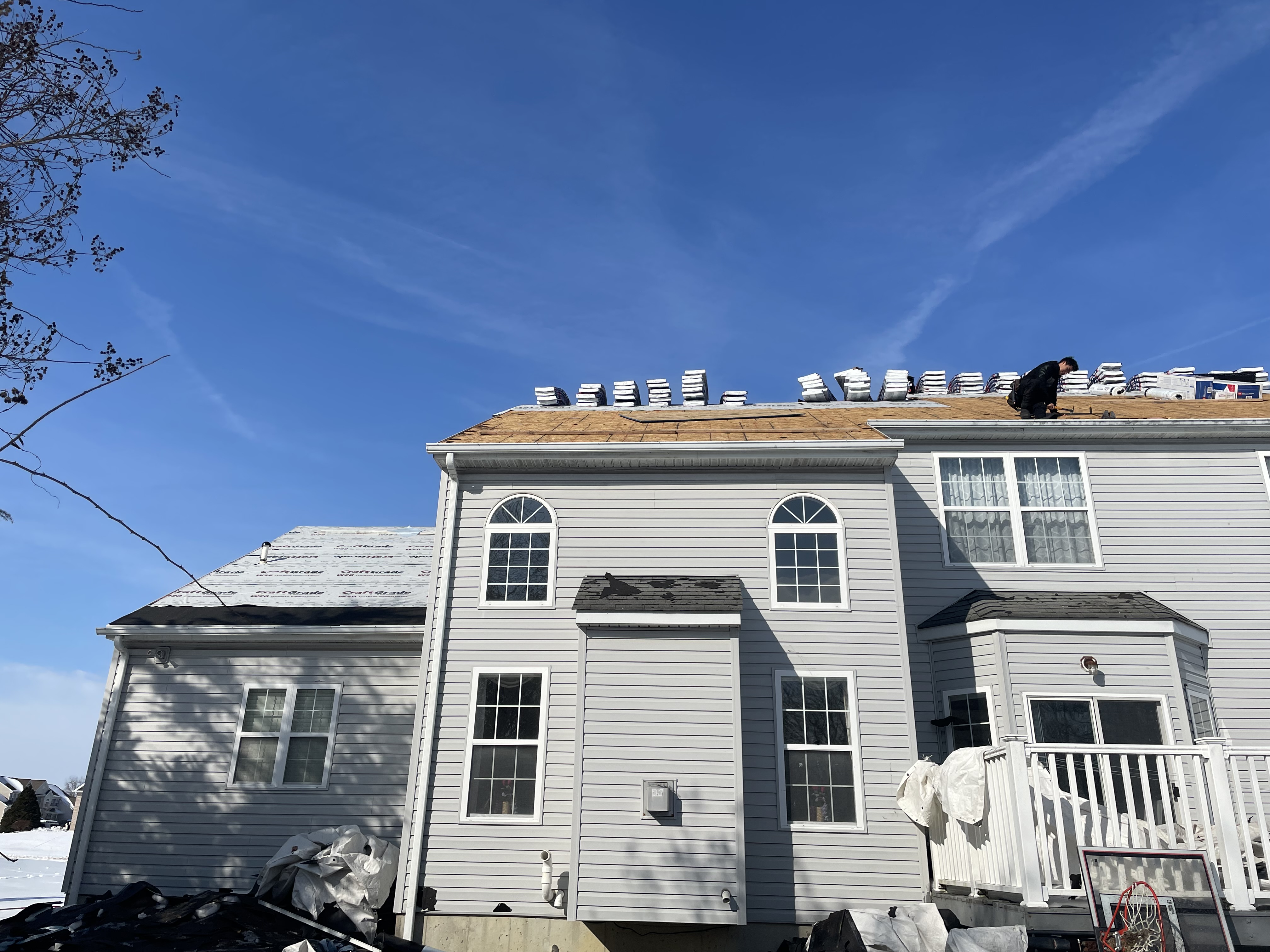 Diamond State crew working on roof