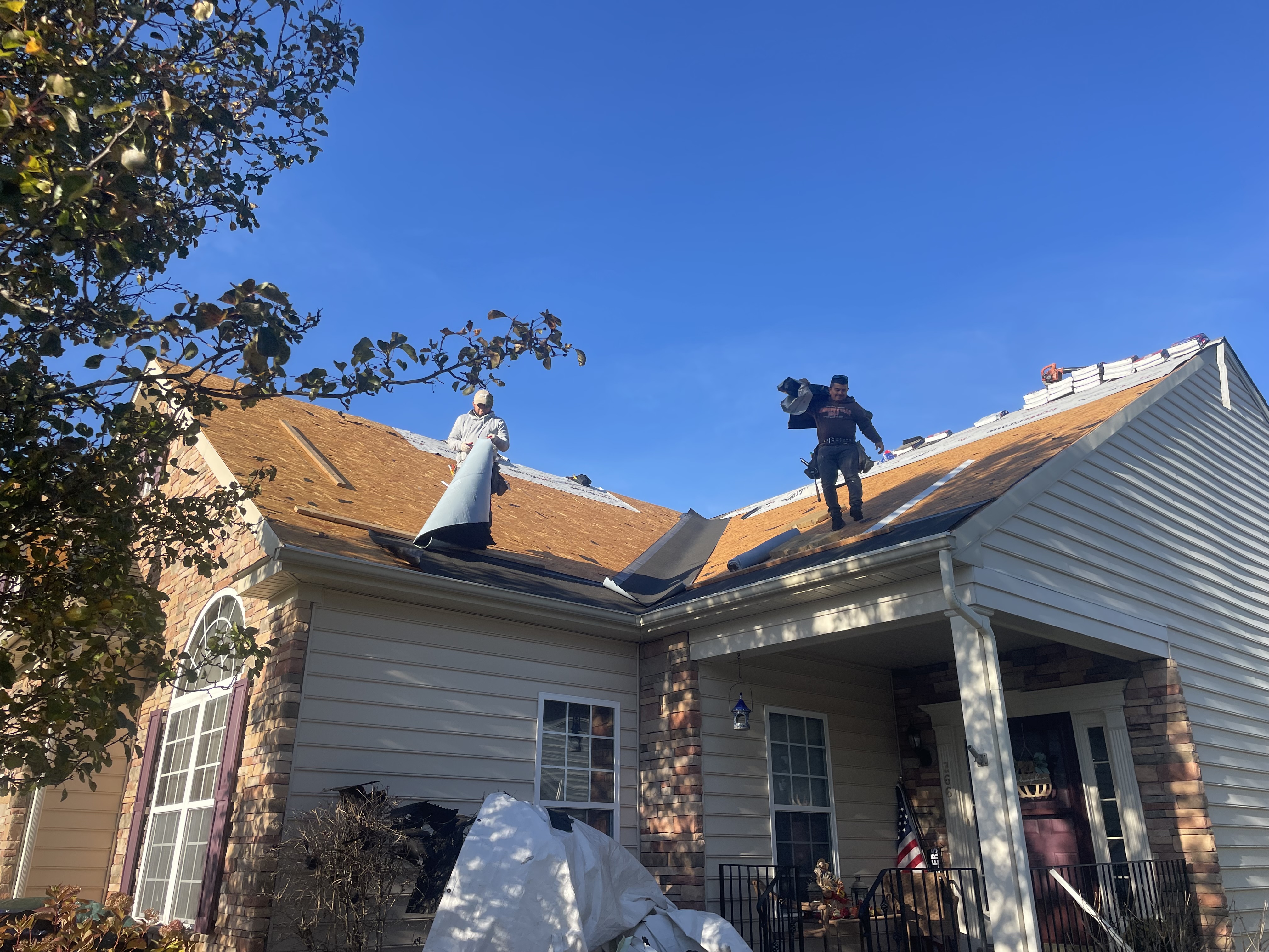 Team working on residential roof