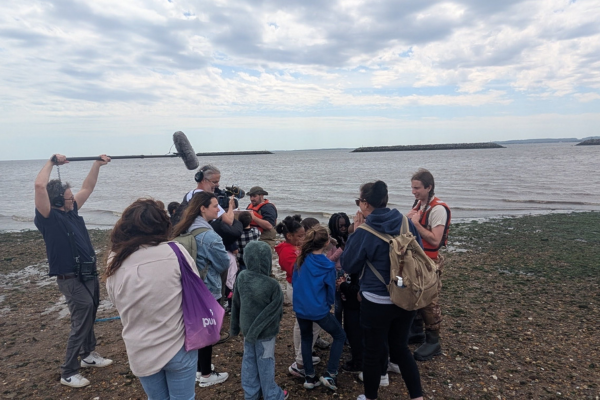 Students gathered on Robinson Beach for a Sandy Ground Historical Society educational shoreline program