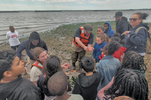 Students observing marine life and restored shoreline habitat near Staten Island Living Breakwaters