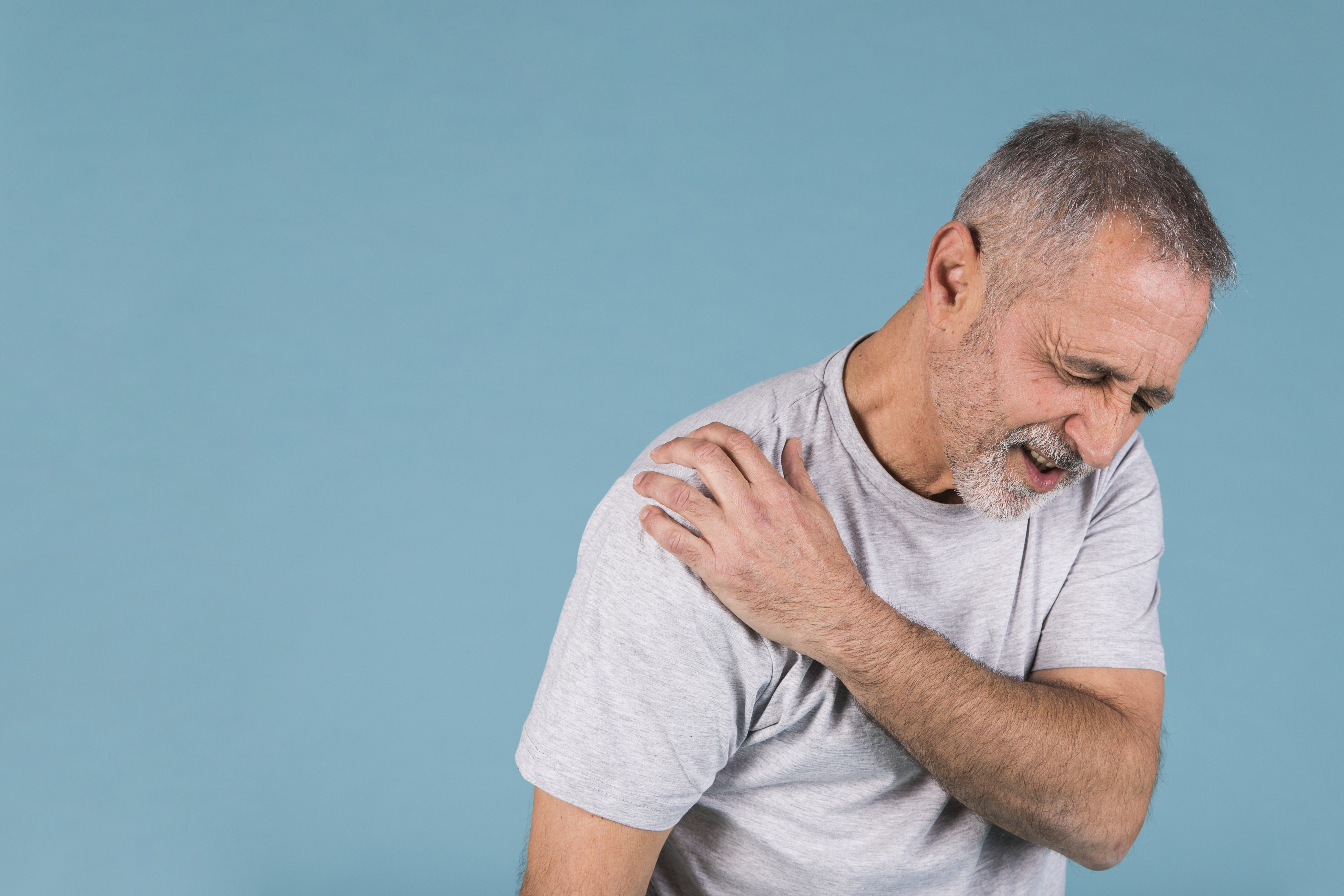 Person experiencing shoulder pain