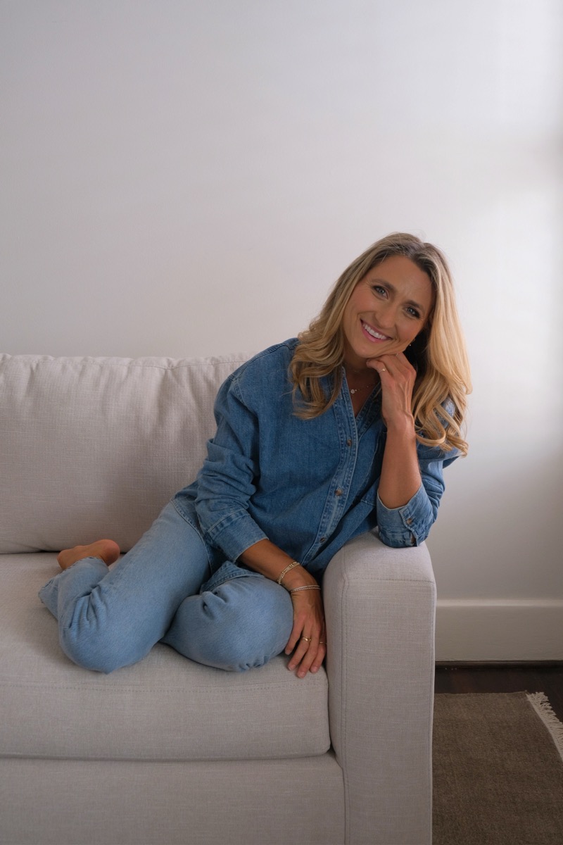 Dallas Cole laughing, seated on a couch