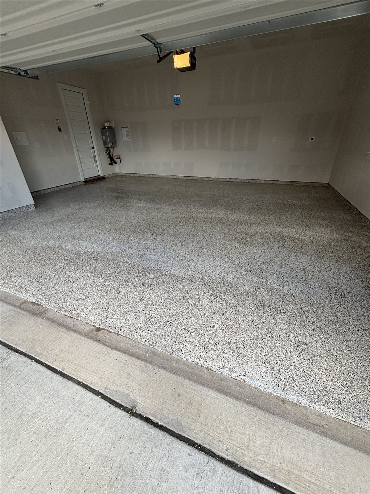 Light flake epoxy garage floor in a Mansfield, TX home