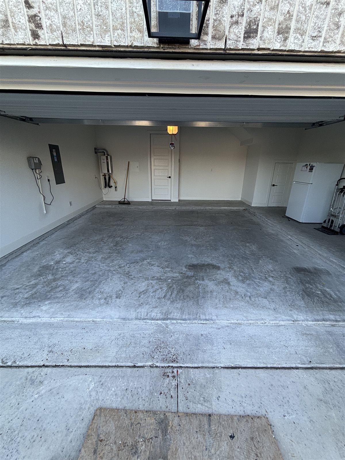 Bare concrete garage floor in a Burleson, TX home before metallic epoxy