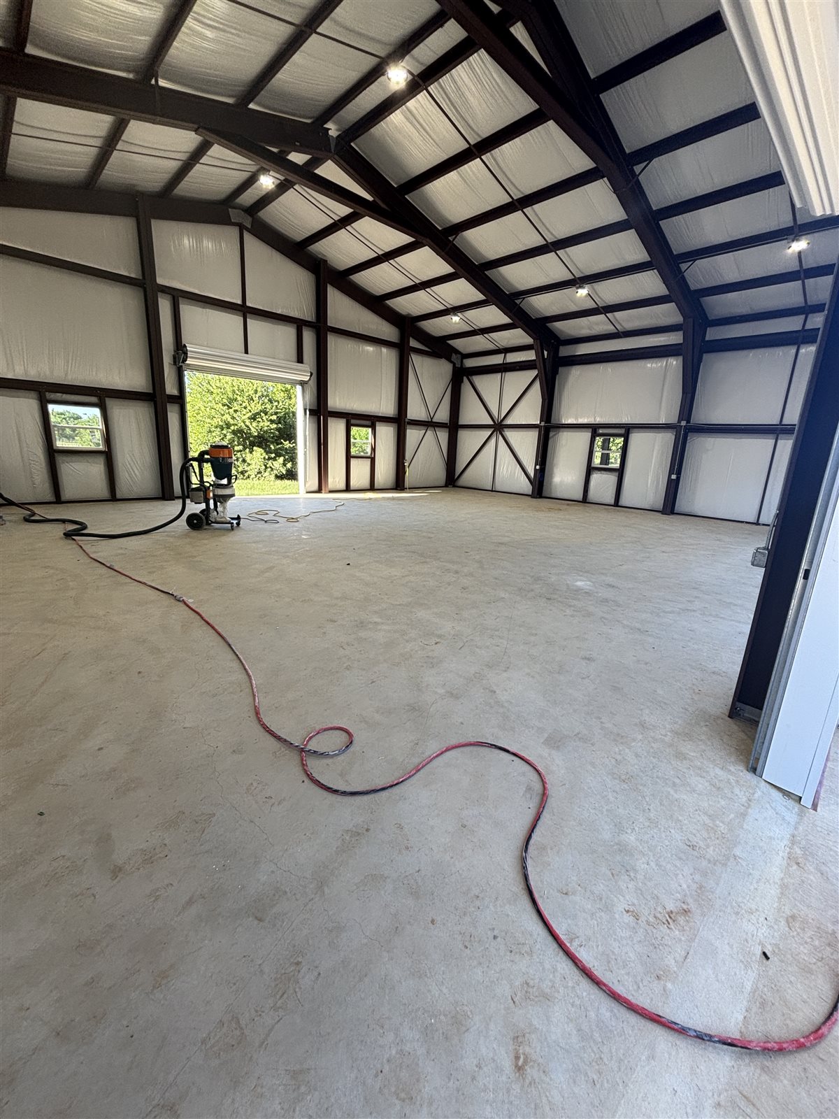 Metal shop building slab in Burleson, TX during diamond grinding