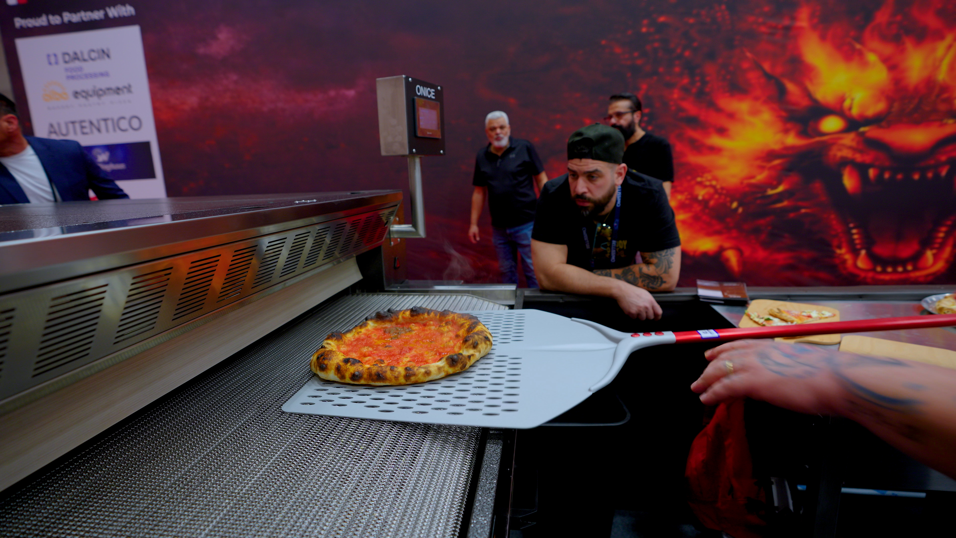 La Bestia electric deck oven baking pizza at PizzaArch booth during Las Vegas Pizza Expo 2026.
