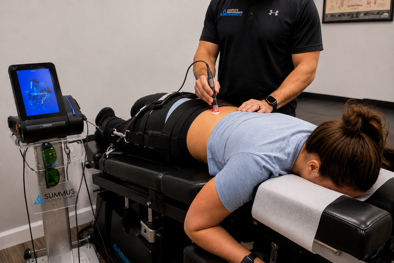 Patient receiving Class IV laser therapy alongside spinal decompression treatment at Complete Performance Chiropractic Patient receiving Class IV laser therapy alongside spinal decompression treatment at Complete Performance Chiropractic
