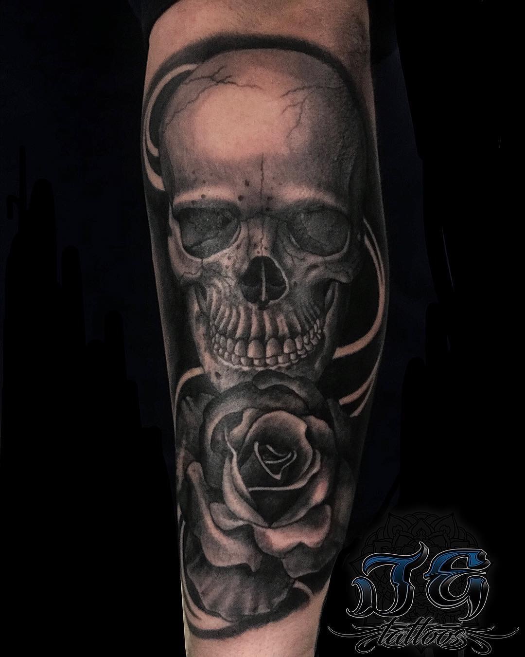 Skull and rose tattoo design by Jest Estevez, showcasing intricate shading and detail, representing artistry at GameFace Tattoos in Orlando, FL.