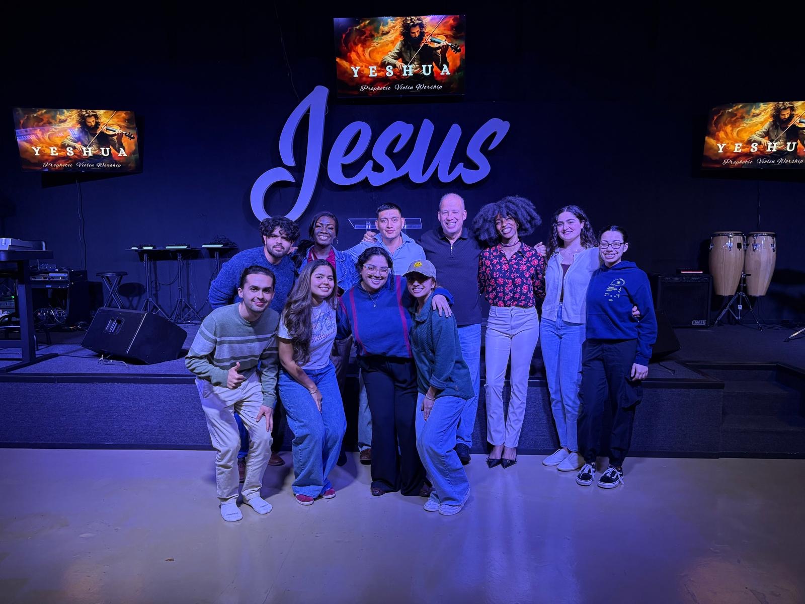 Young leaders in prayer during a Next Gen session