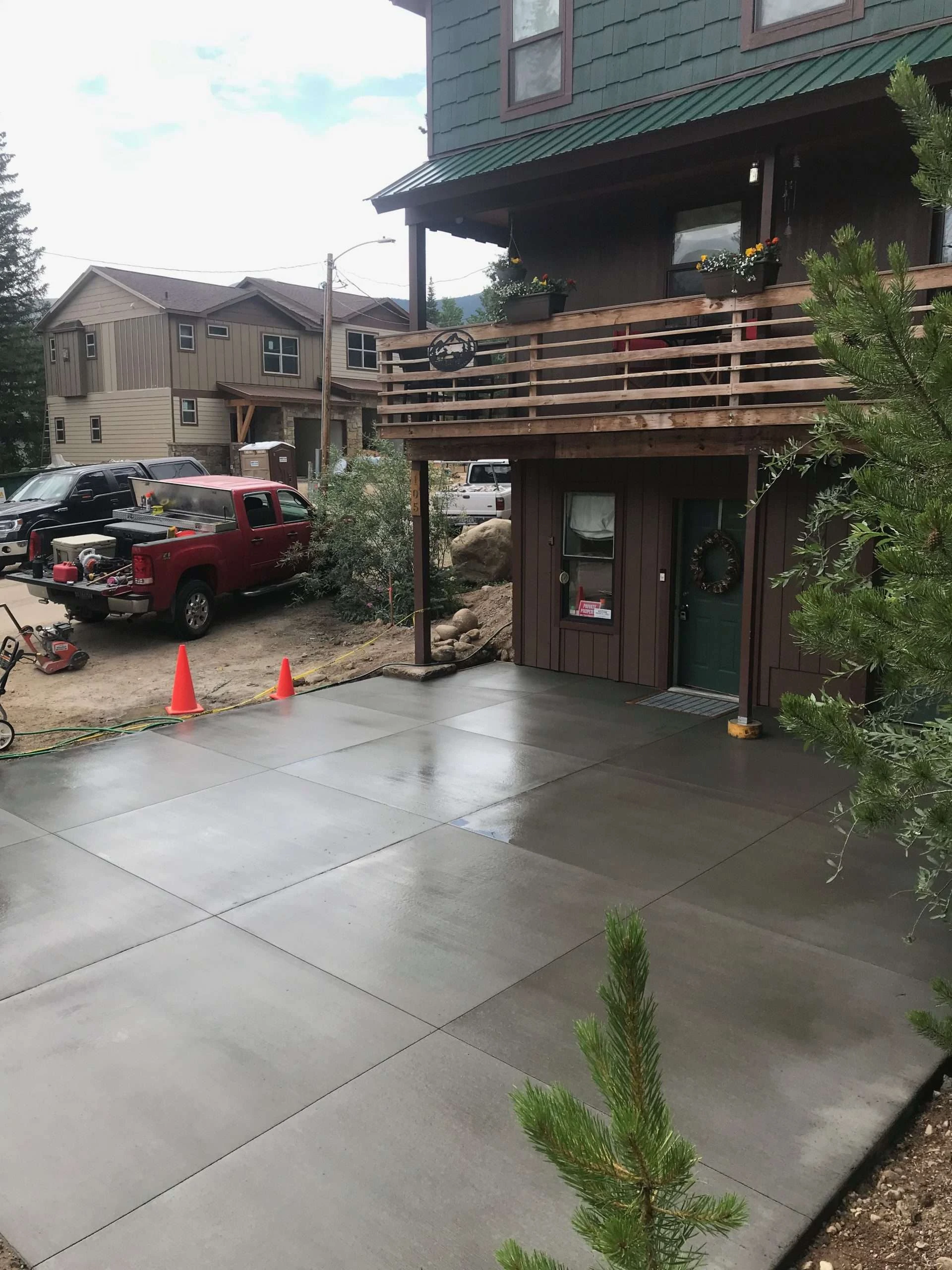 Concrete driveway with stamped border at custom mountain home