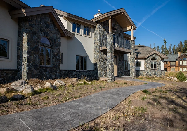 Concrete walkway connecting outdoor spaces
