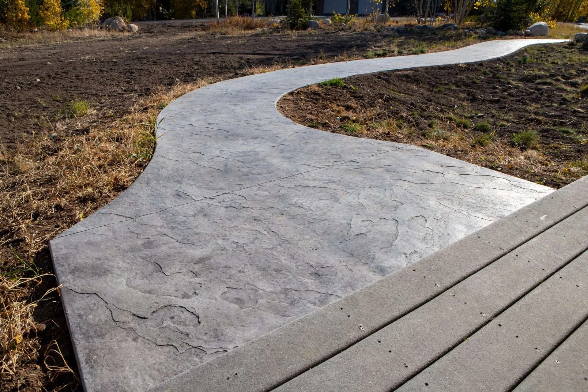 Concrete walkway connecting outdoor spaces