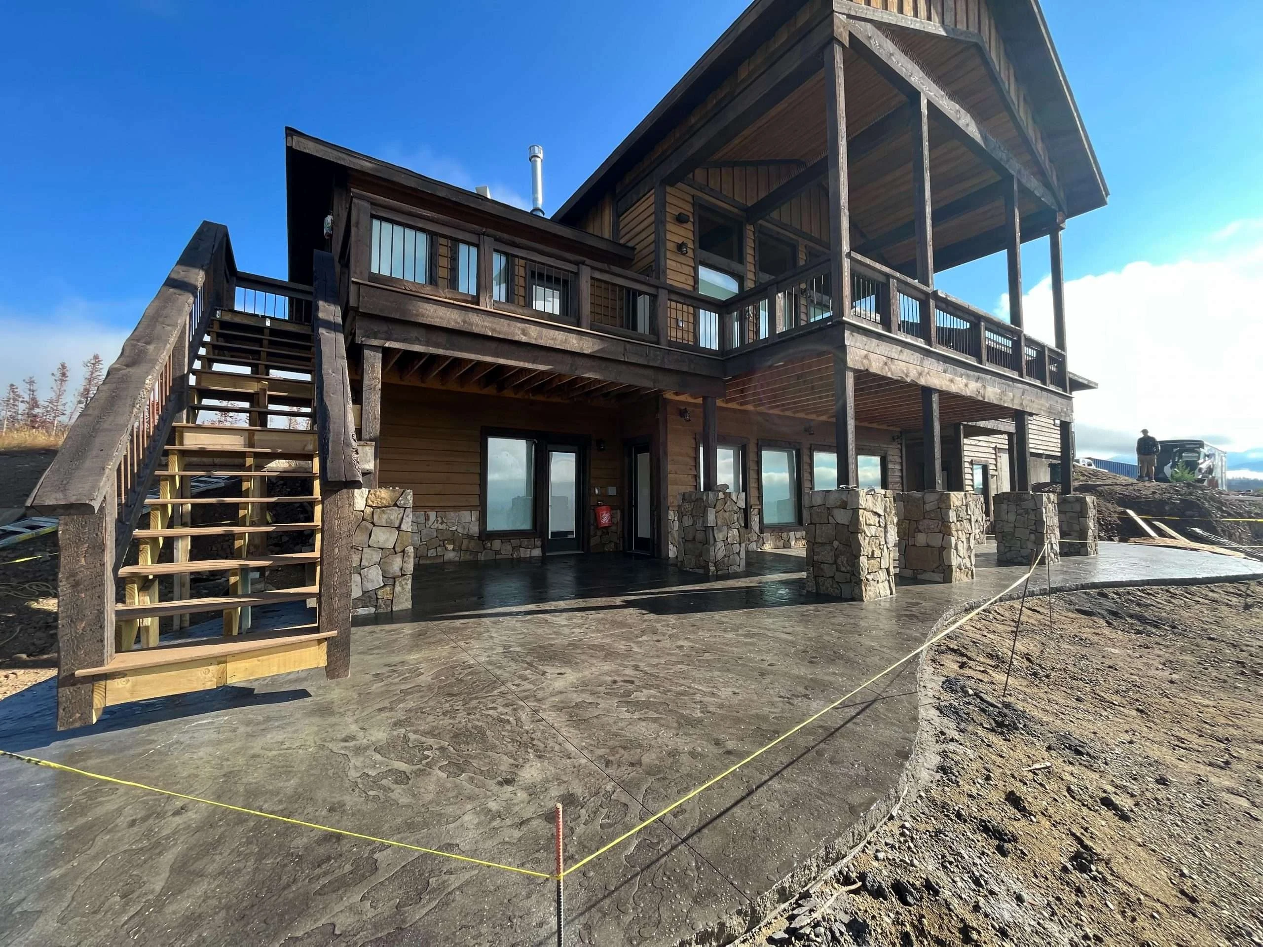 Stamped concrete driveway with mountain backdrop in Grand County, Colorado