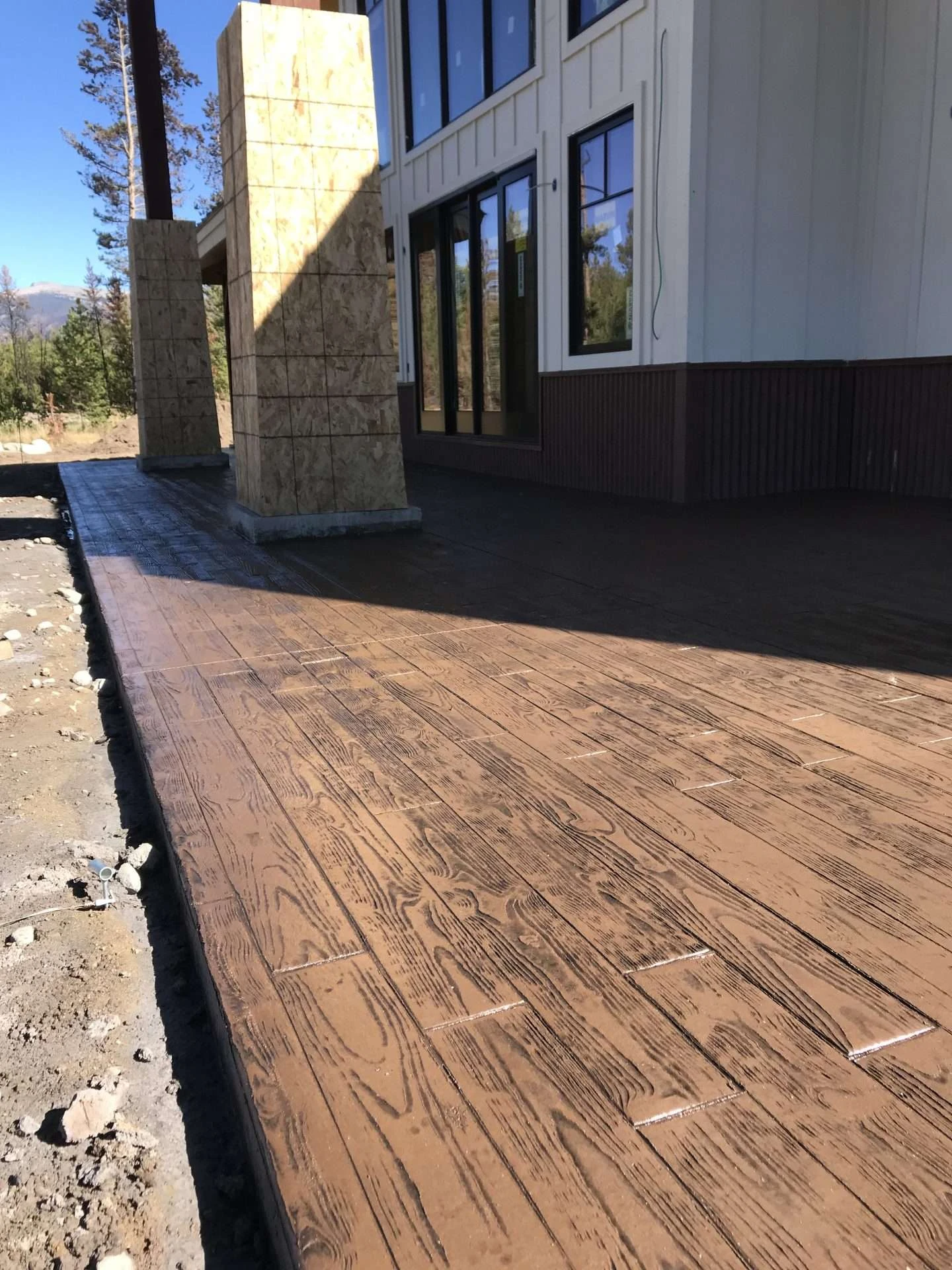 Stamped concrete patio with integrated fire pit pad