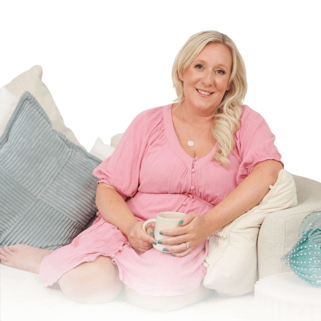 Sophie smiling, holding a mug