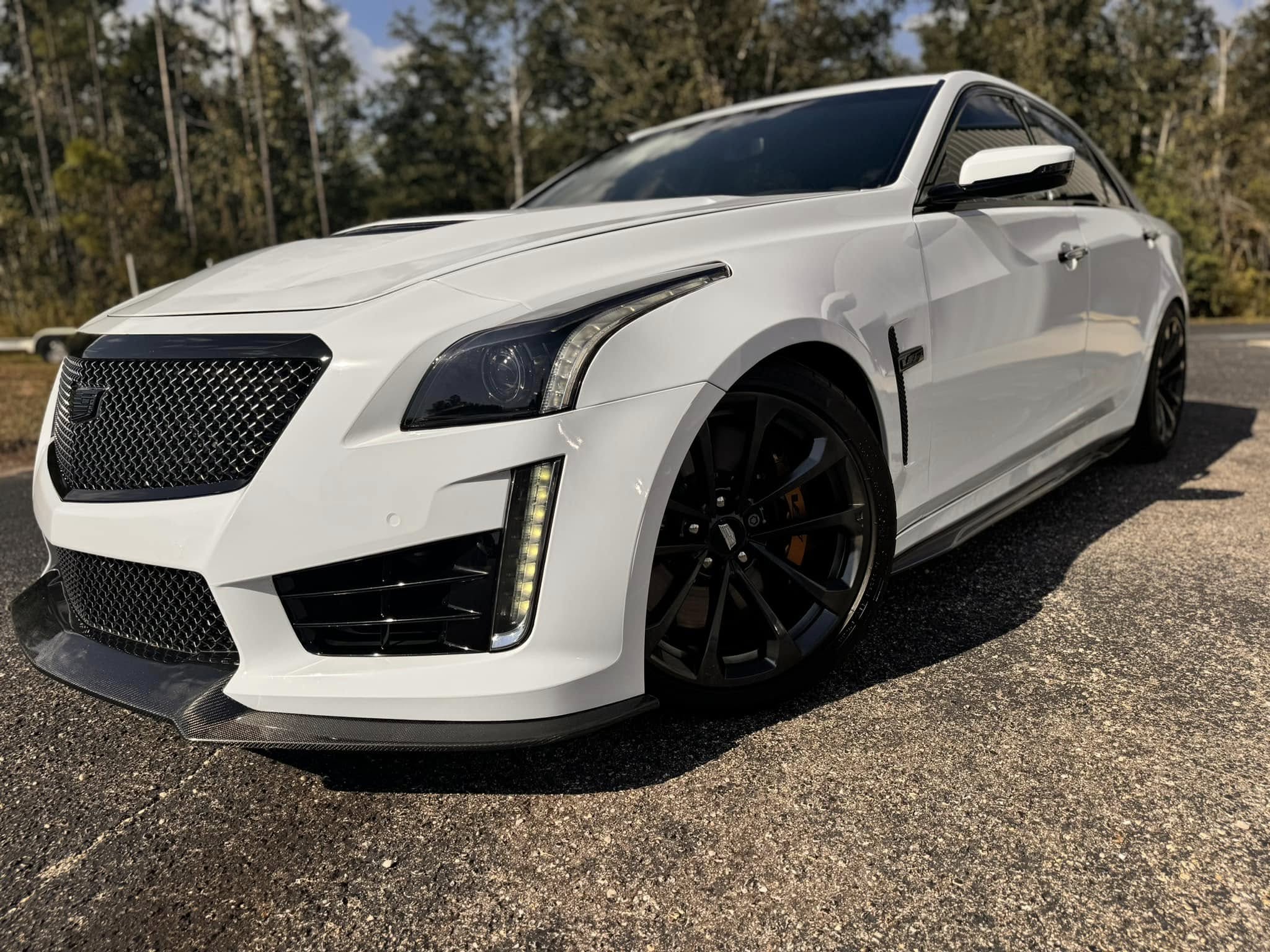 Cadillac Ceramic Coating and window tint job by LUX Customs