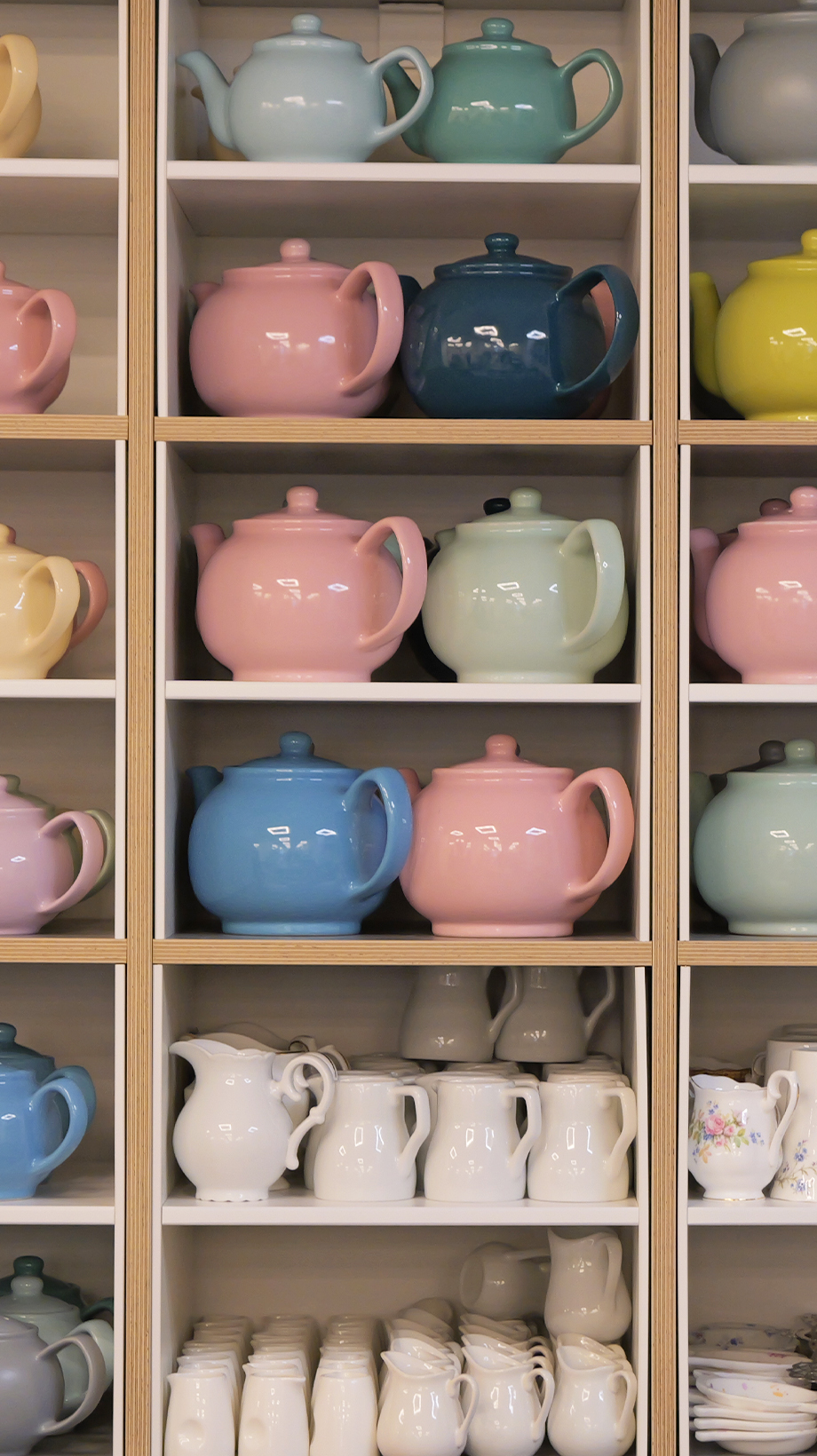 Shelves of colourful teapots