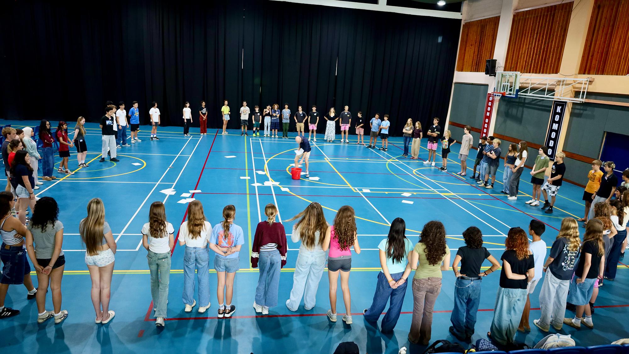 Teens gathered in a large connection circle at Empower U Bali
