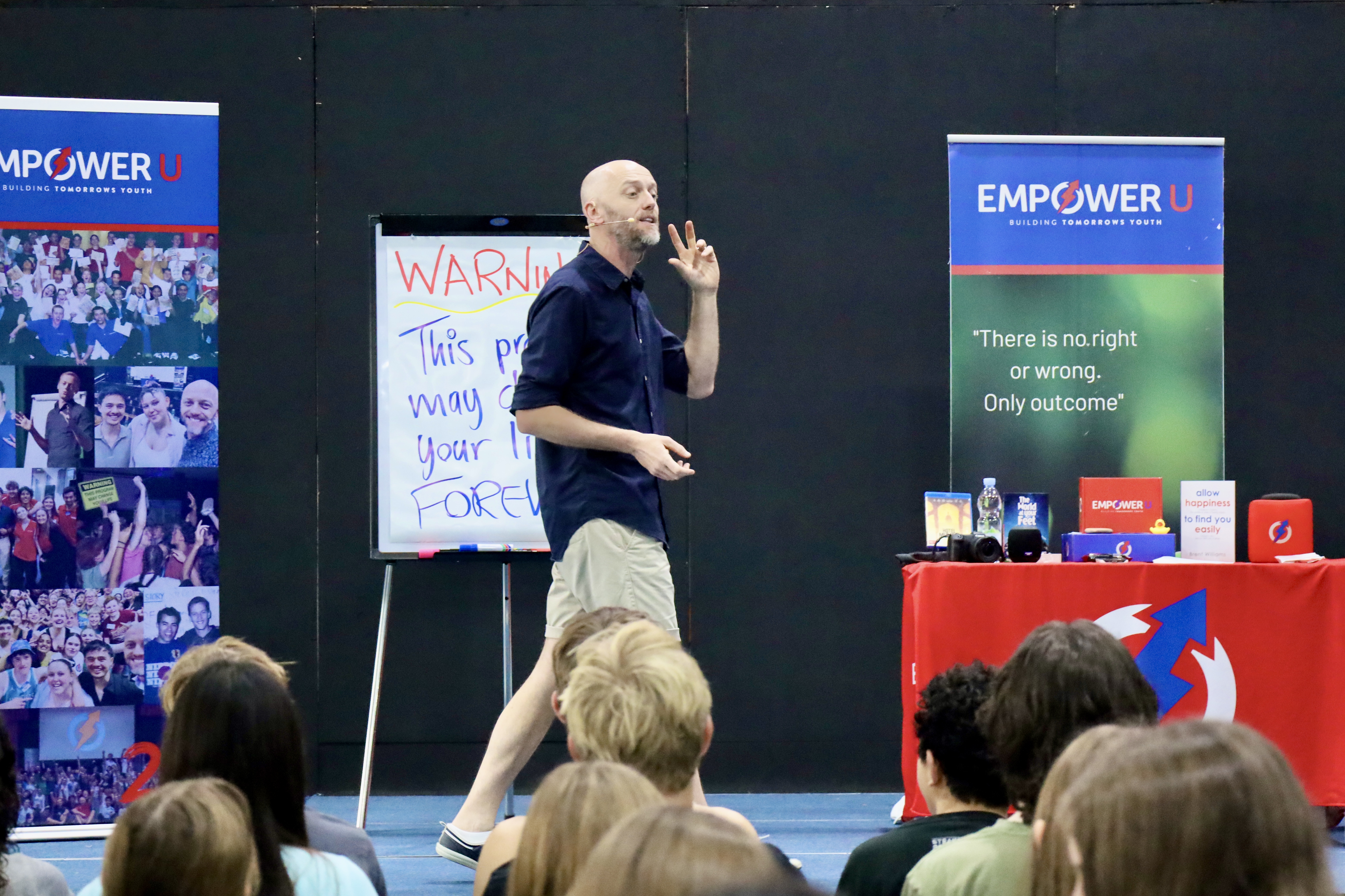Brent presenting on stage at Empower U Bali