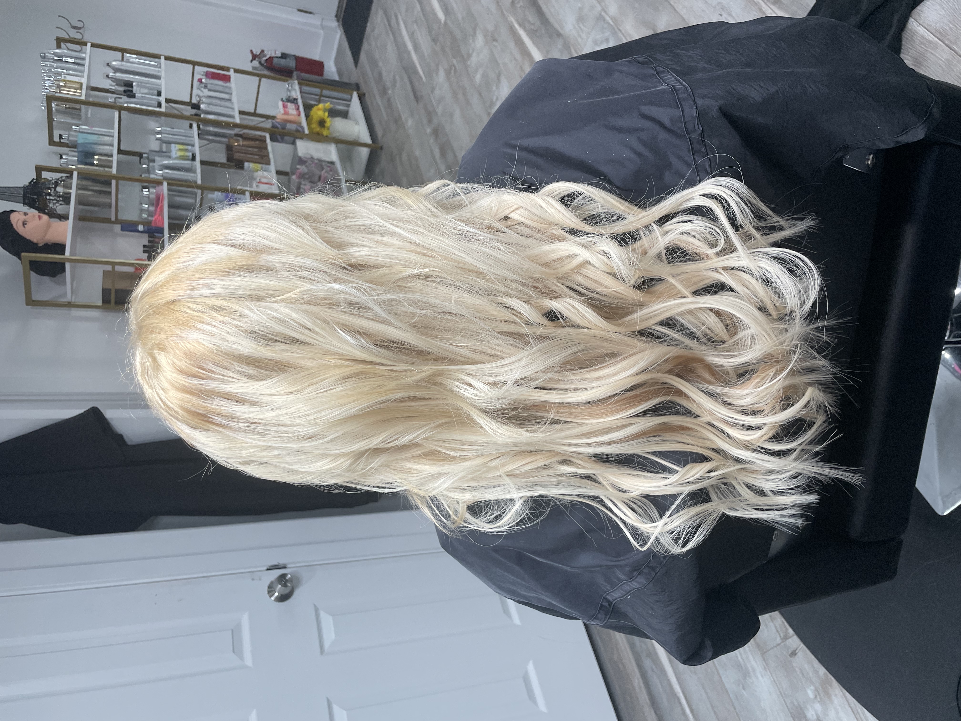 Long bright blonde hair extensions by Beauty Empowered
