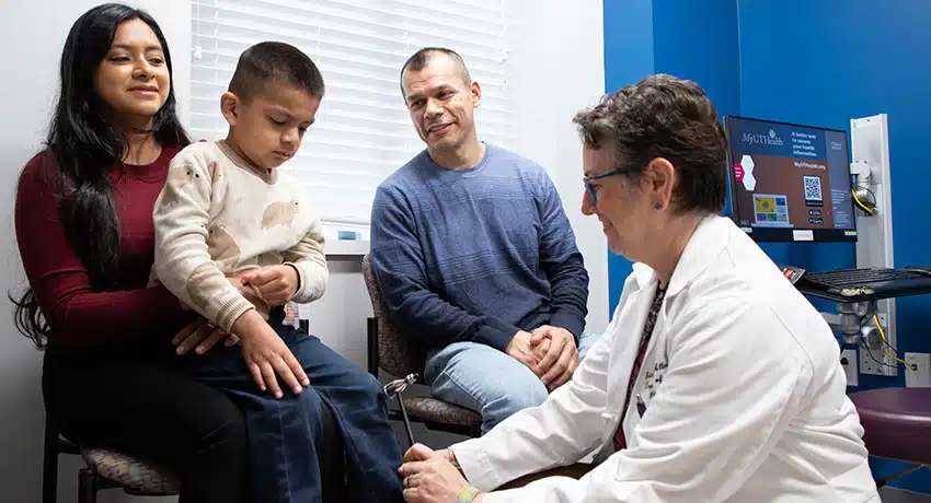 Healthcare provider consulting with family