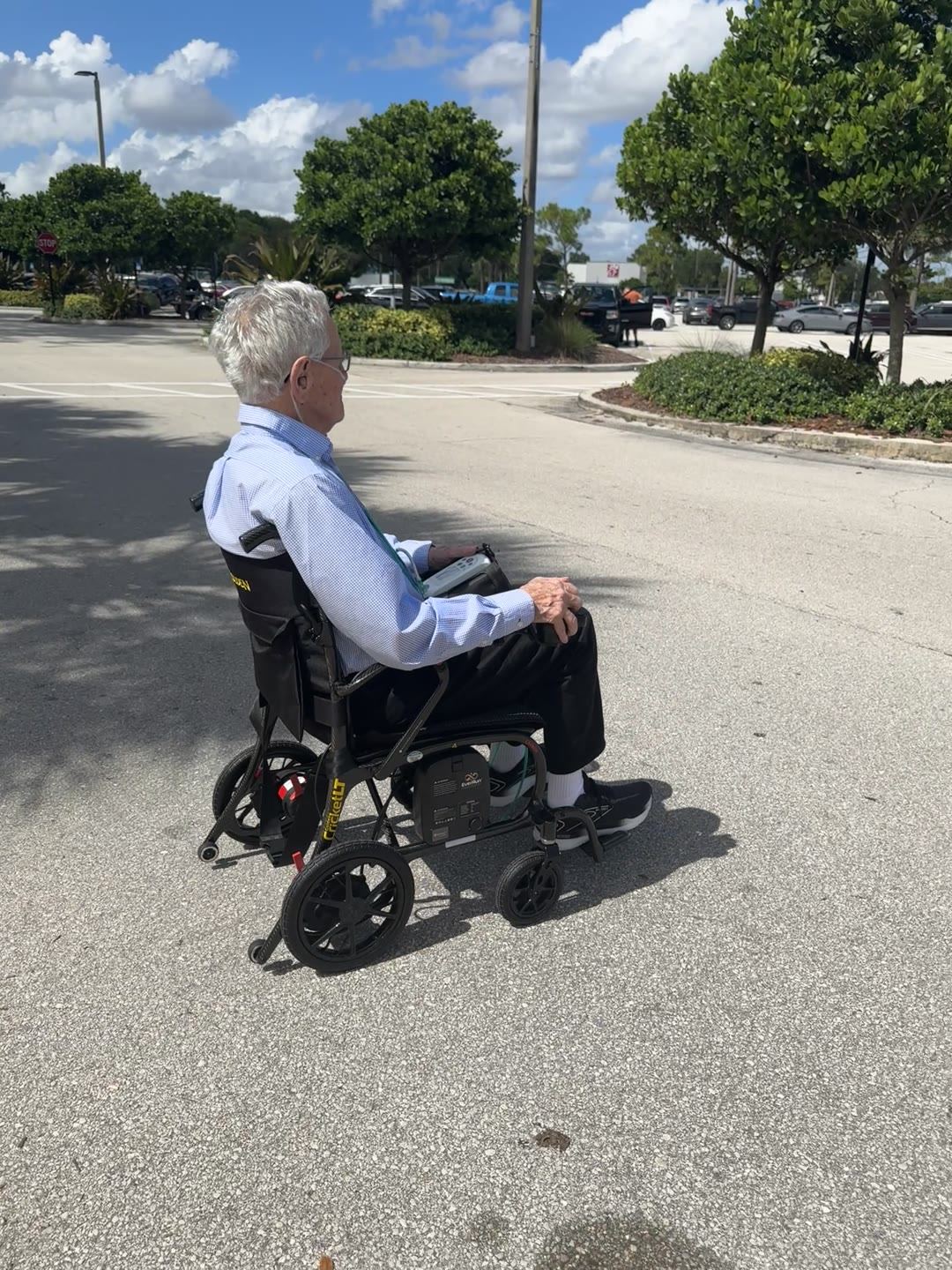 A rider crossing a parking lot on the Cricket LT Carbon