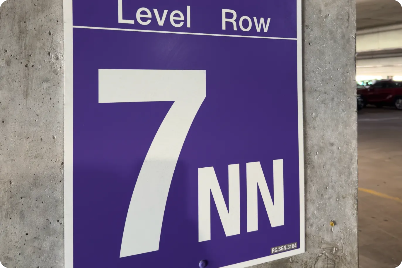 Example of a Cypress Garage level and row sign — your row is confirmed with your booking