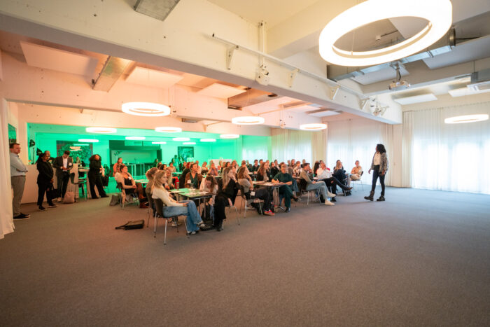 Sharon speaking to a room