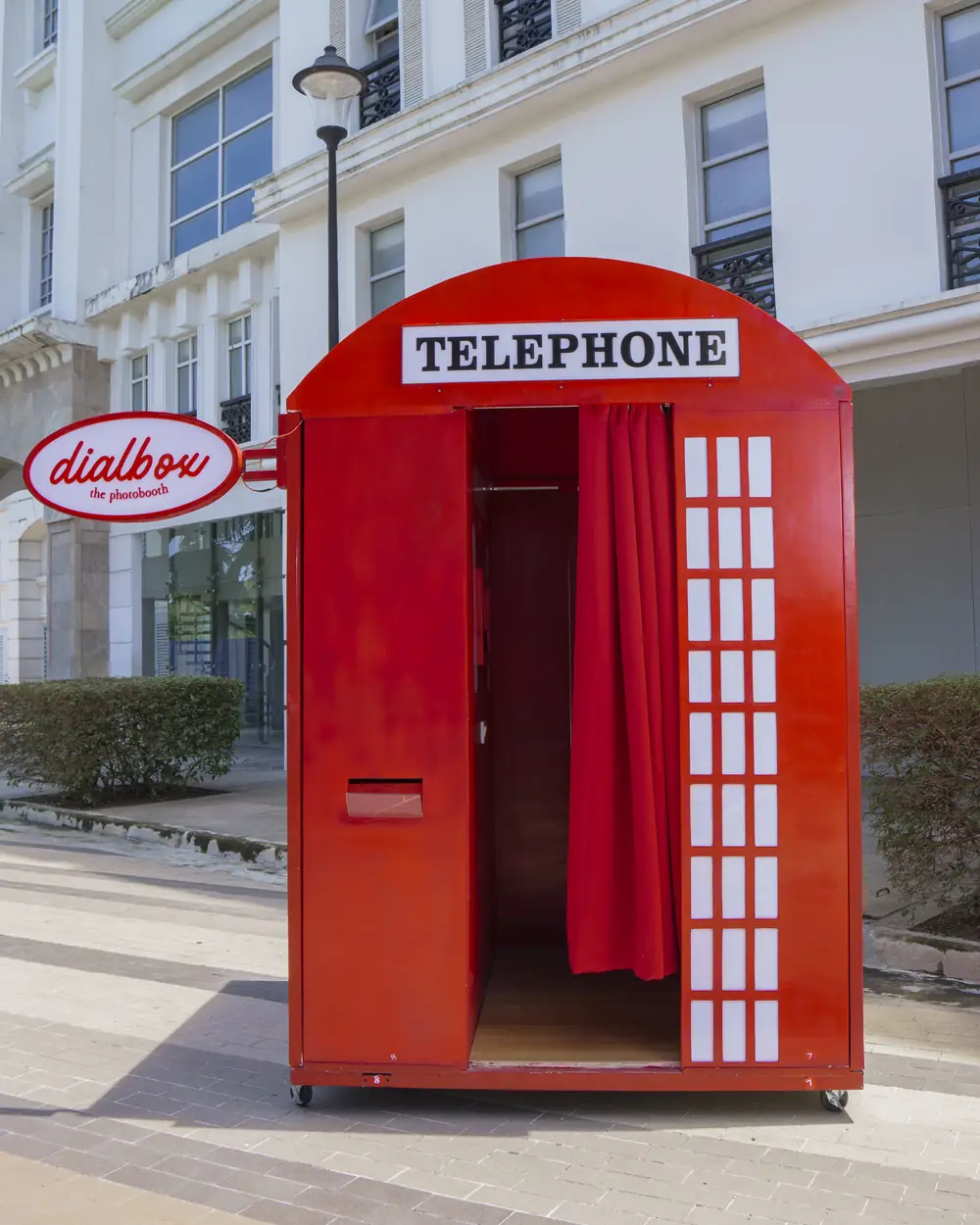 The empty Dialbox booth with its curtain drawn open
