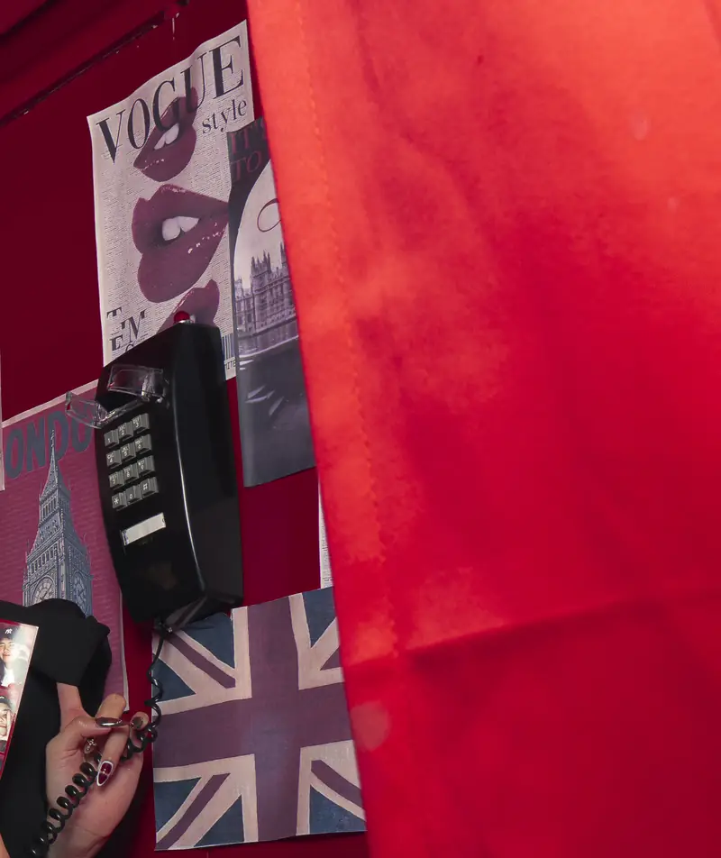 Detail of the booth interior: wall phone and Union Jack