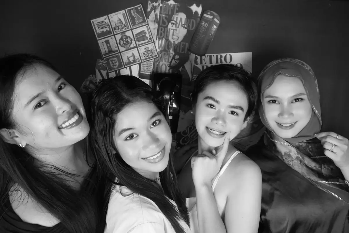 Four friends in black and white at Pixel Diner