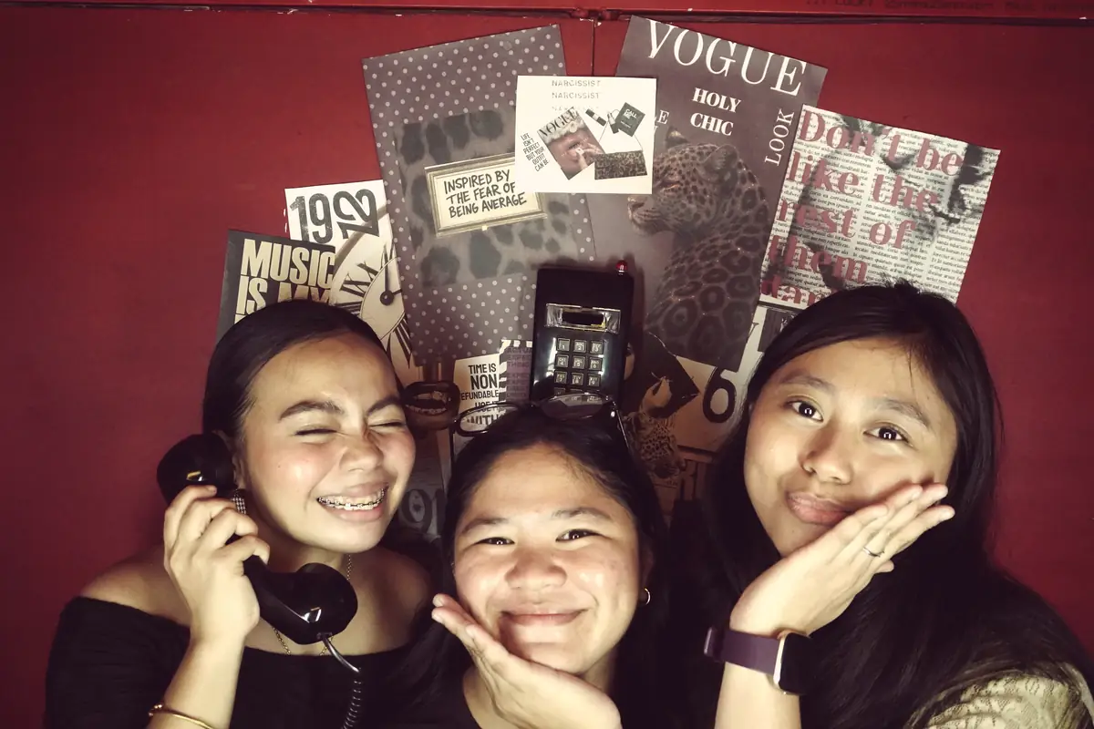 Three friends posing with the phone at Pug Street