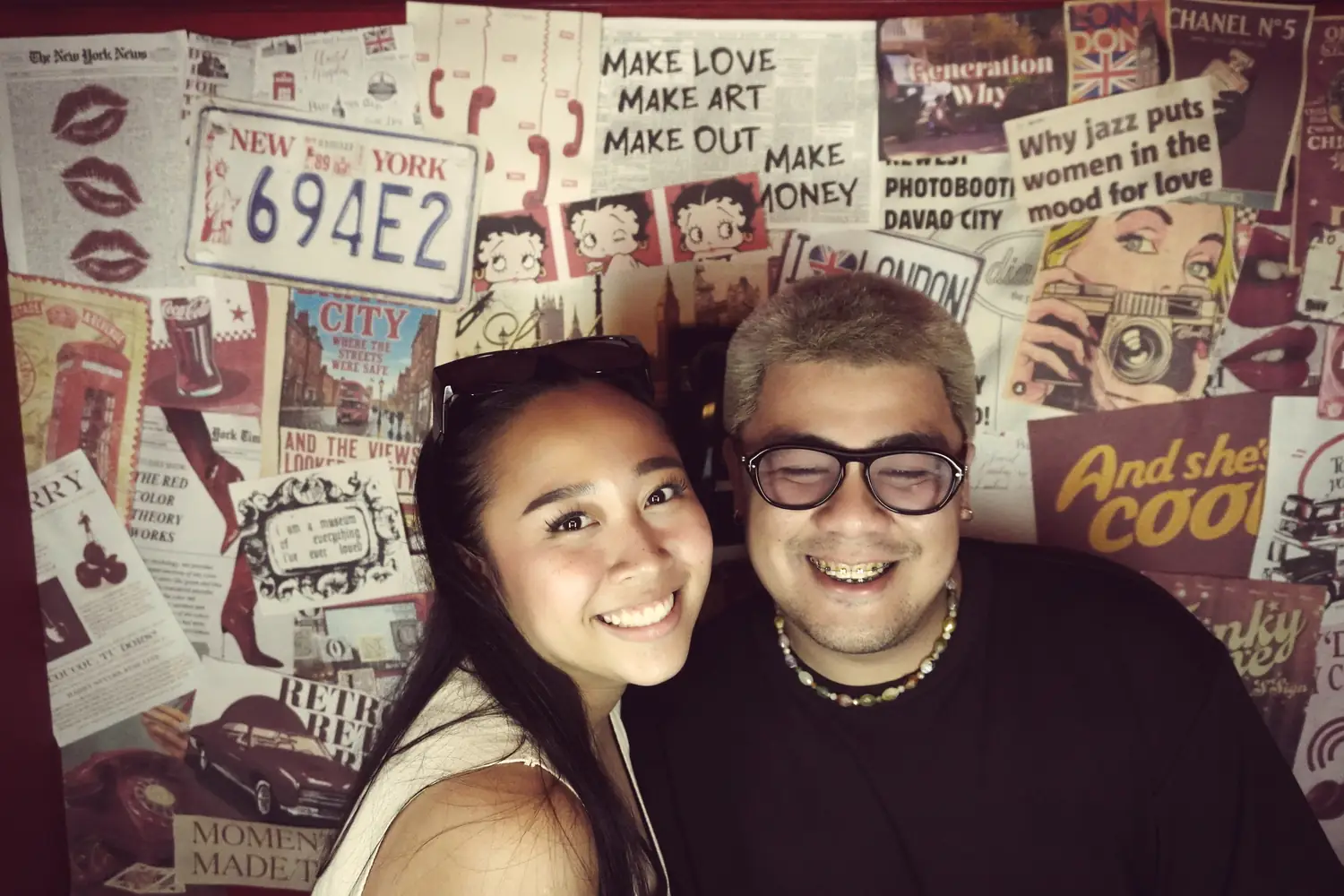 A couple grinning in the booth at Sandera Weekend Market