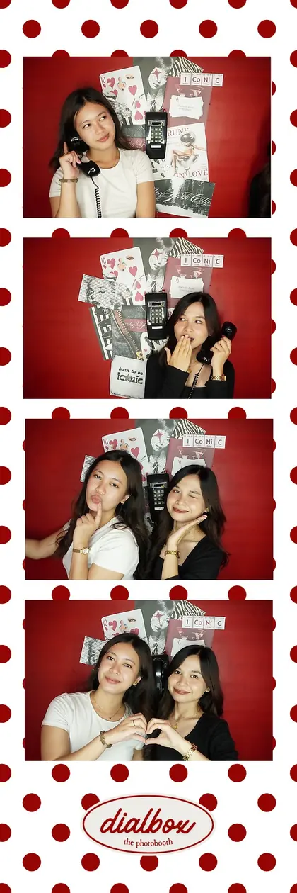 A Dialbox strip with a red polka-dot border: two friends at Big House