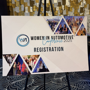 Registration sign for Women In Automotive 2025 Nashville TN