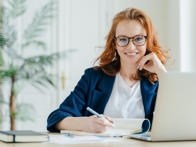 Professional woman documenting career accomplishments and leadership wins