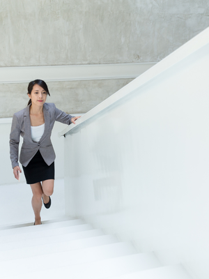 Professional woman advancing her career while carrying pressure to prove herself Professional woman advancing her career while carrying pressure to prove herself