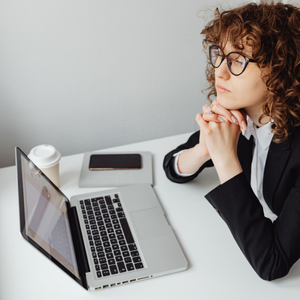 Woman evaluating healthy and unhealthy workplace pressures Woman evaluating healthy and unhealthy workplace pressures