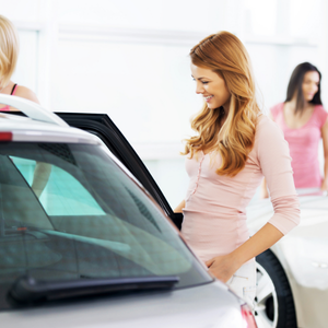 Women influencing automotive purchasing decisions at dealership Women influencing automotive purchasing decisions at dealership